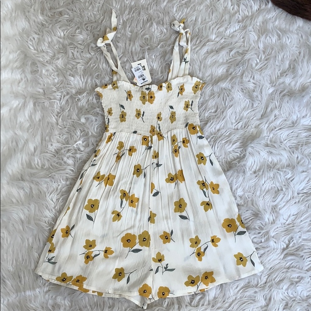 Never worn romper! Still has tags on!